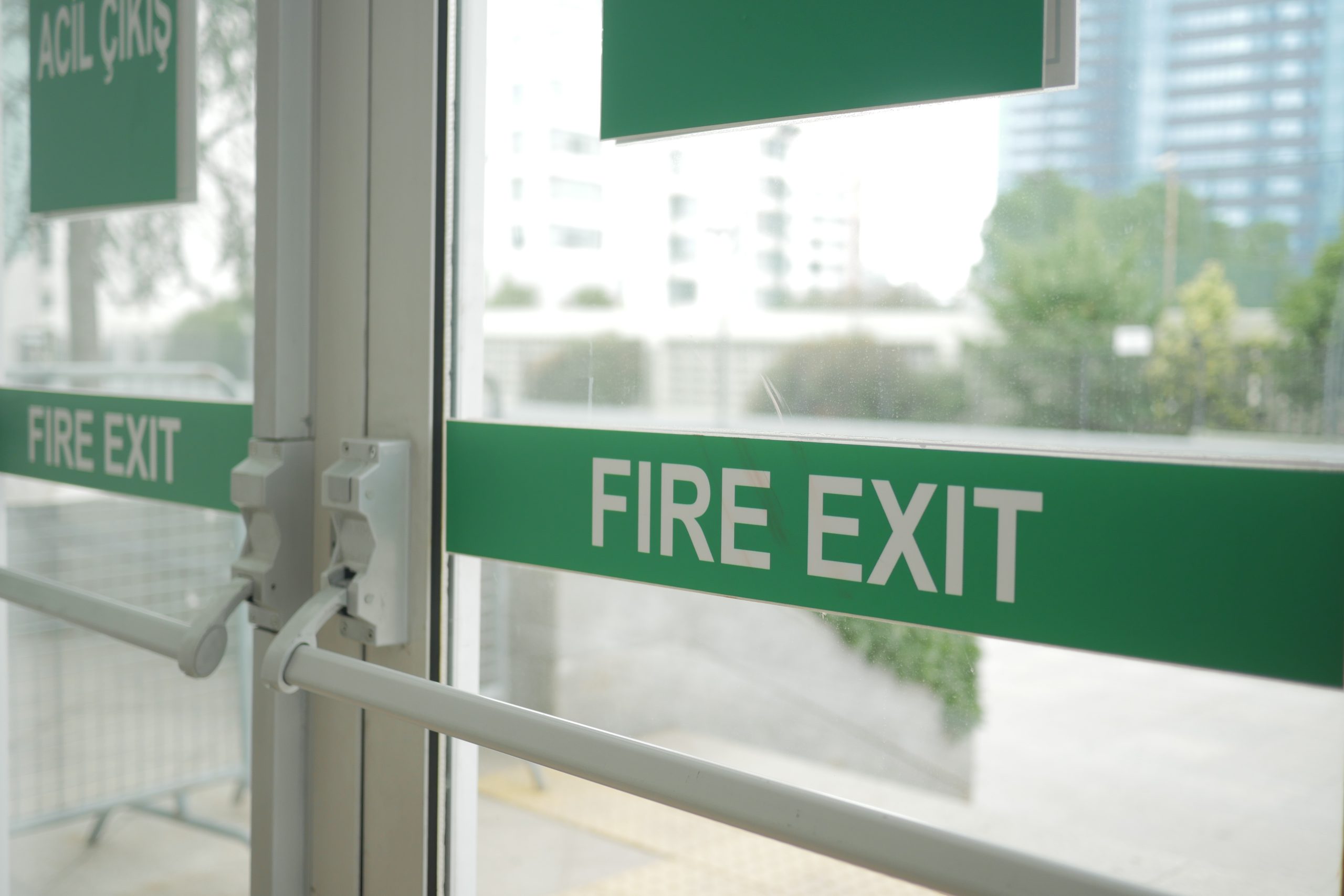 Clear fire exit door with green highlight
